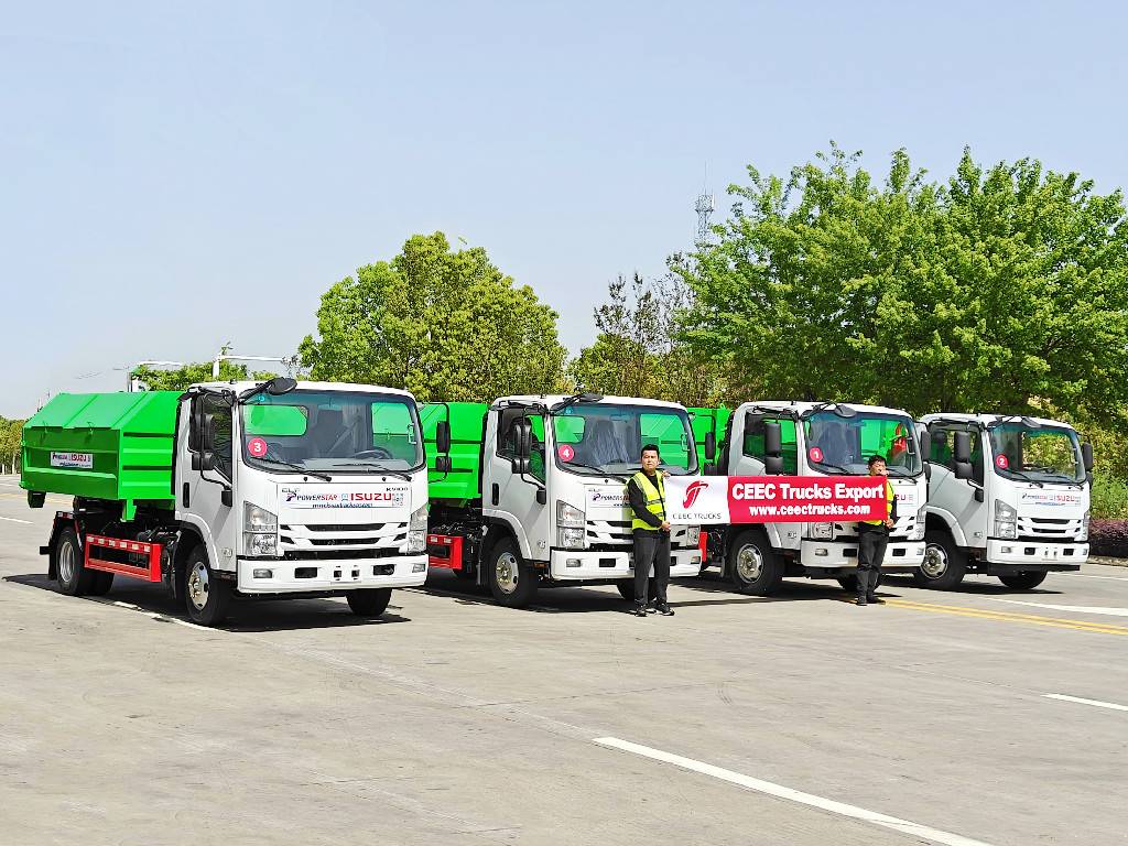 Isuzu hook loader trucks ready for shipment